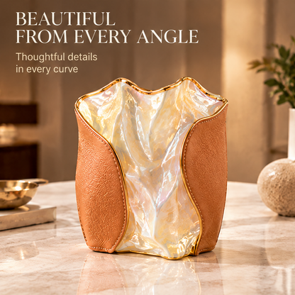 Close-up of glazed ceramic and stitched genuine leather with material and texture information.