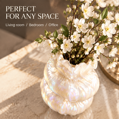 Overhead view of the pearl white tiered vase with white blossoms and room styling text.